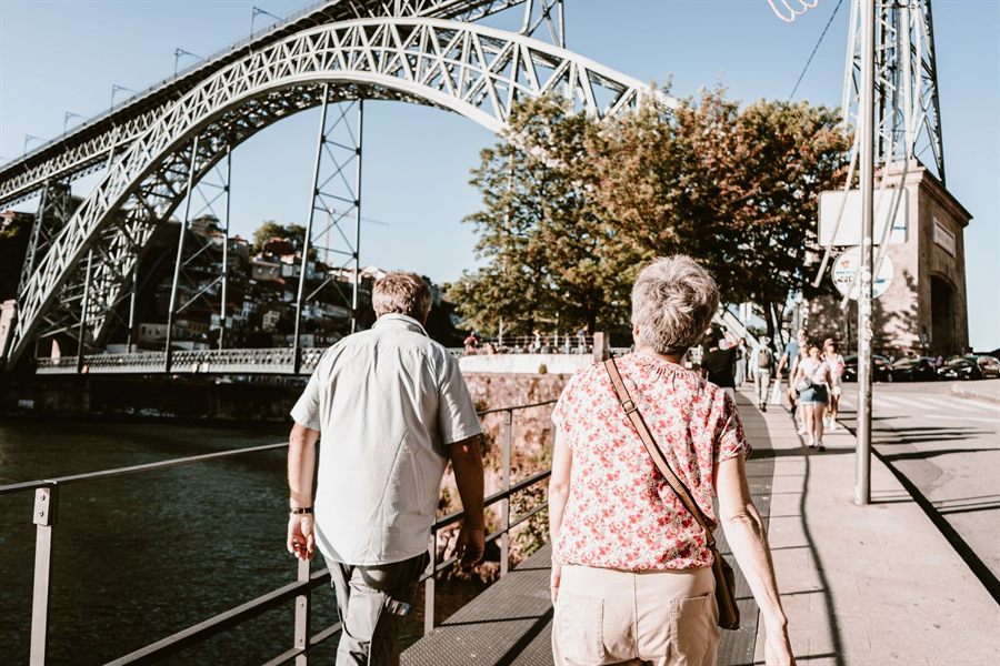 Older couple walking along the Douro in Porto